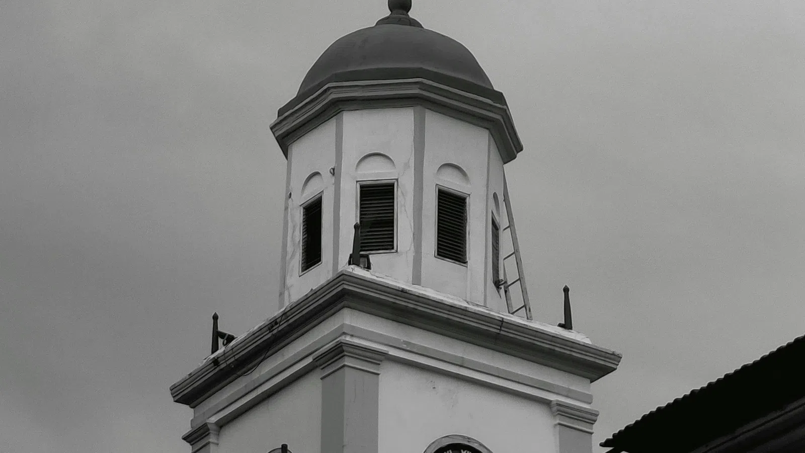 Black and white photo of a historic clock tower with weather vane under cloudy sky.Home Inspectors in Toccoa, GA, Stephens, 30598 Home Inspections, Certified Home Inspectors, Residential and Commercial Home Inspections in Toccoa, GA, Stephens, 30598