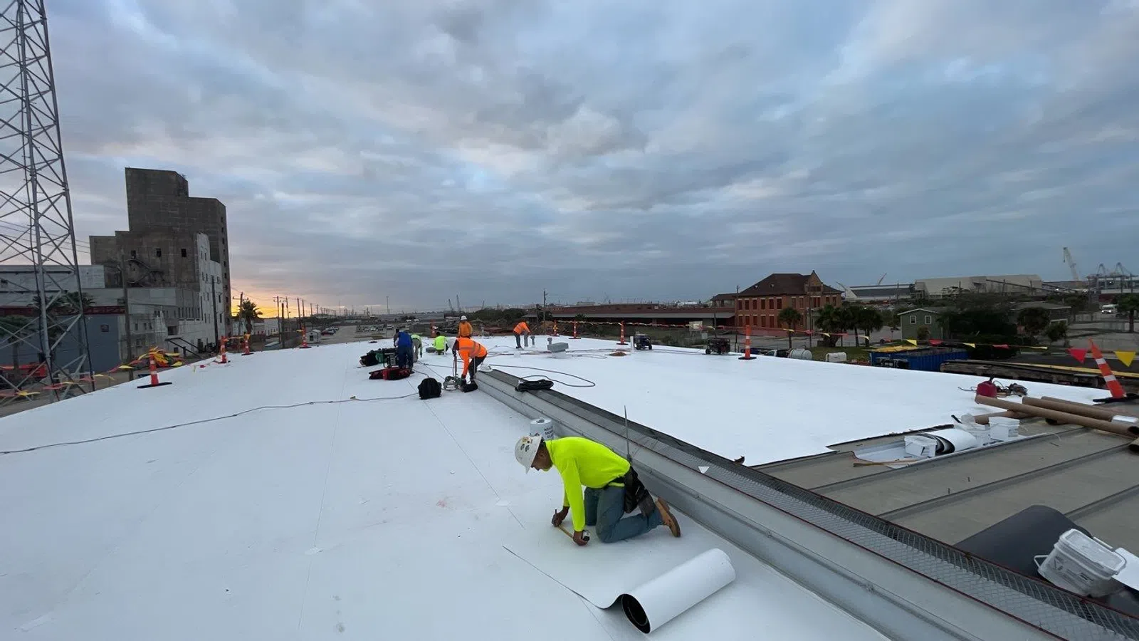 a group of people working on a roof