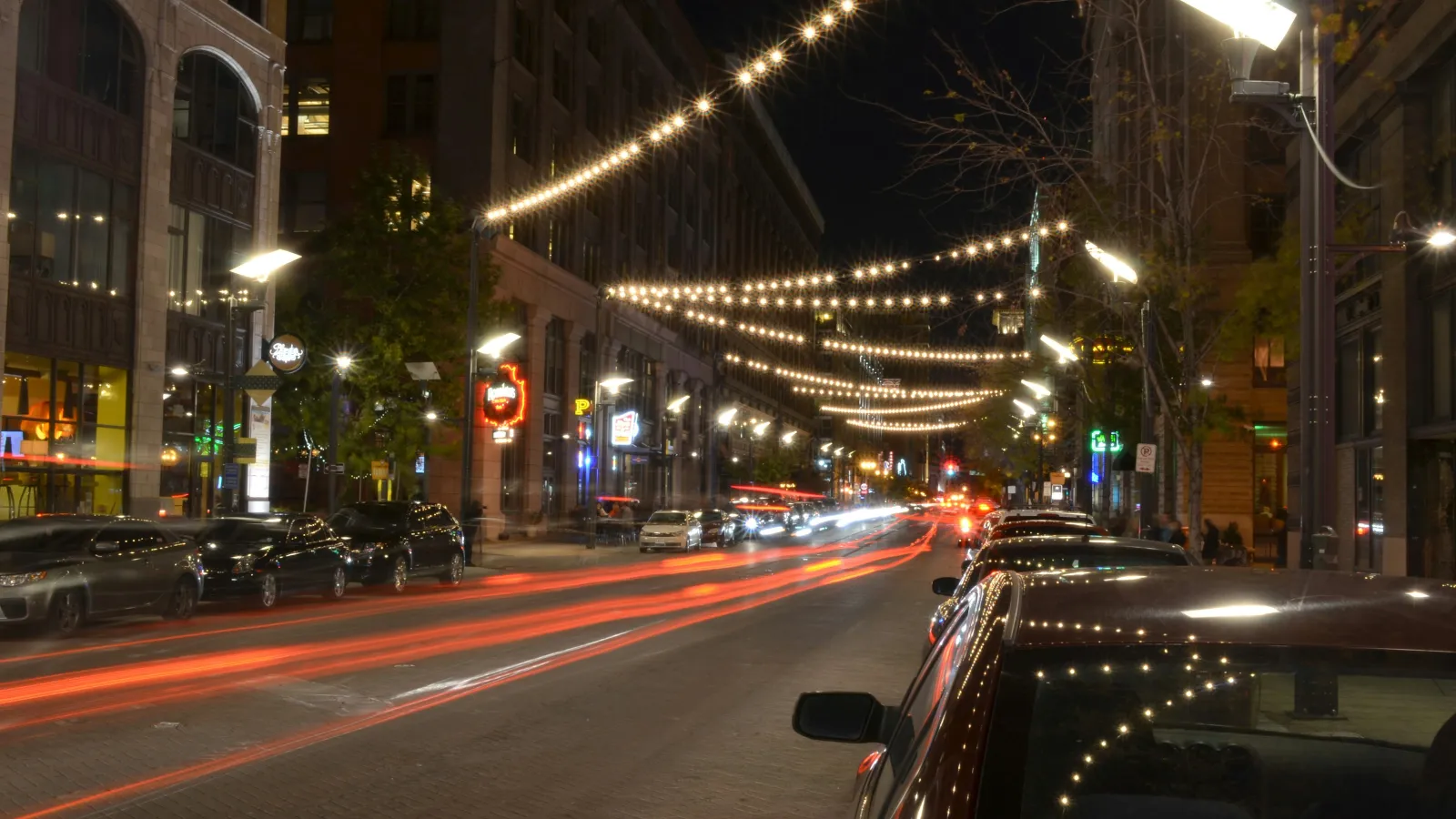 a street with cars and buildings on either side of it