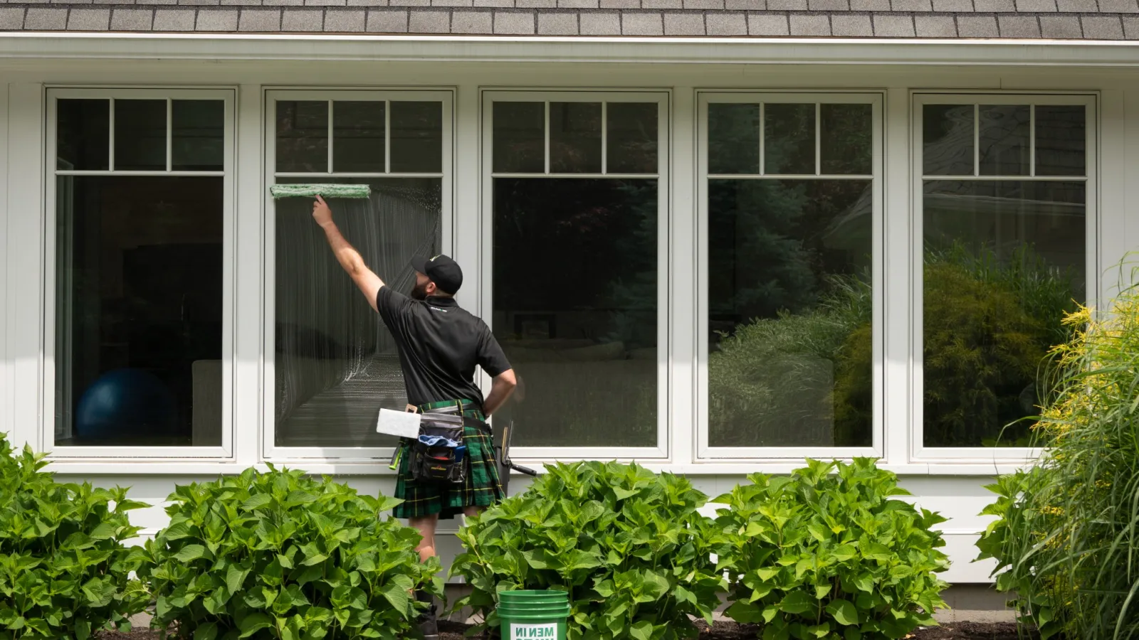 a man standing outside a house