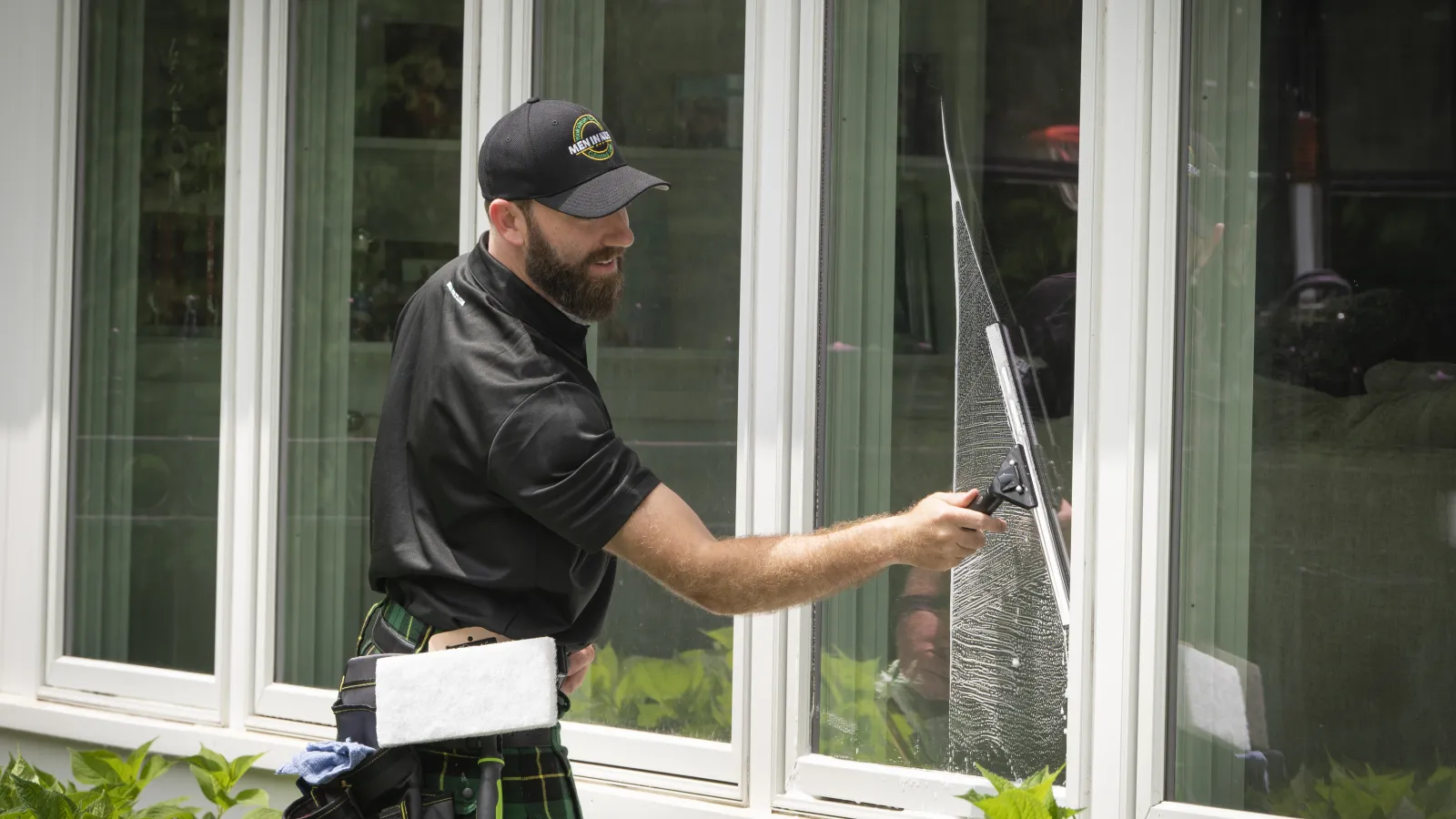 a man cleaning a window