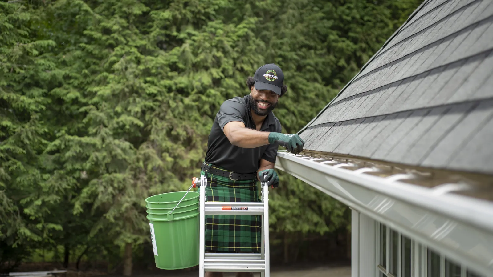 a person holding a green bucket