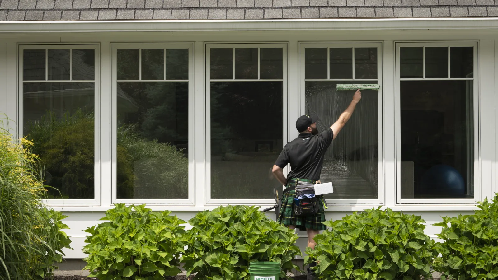 a man standing outside a house