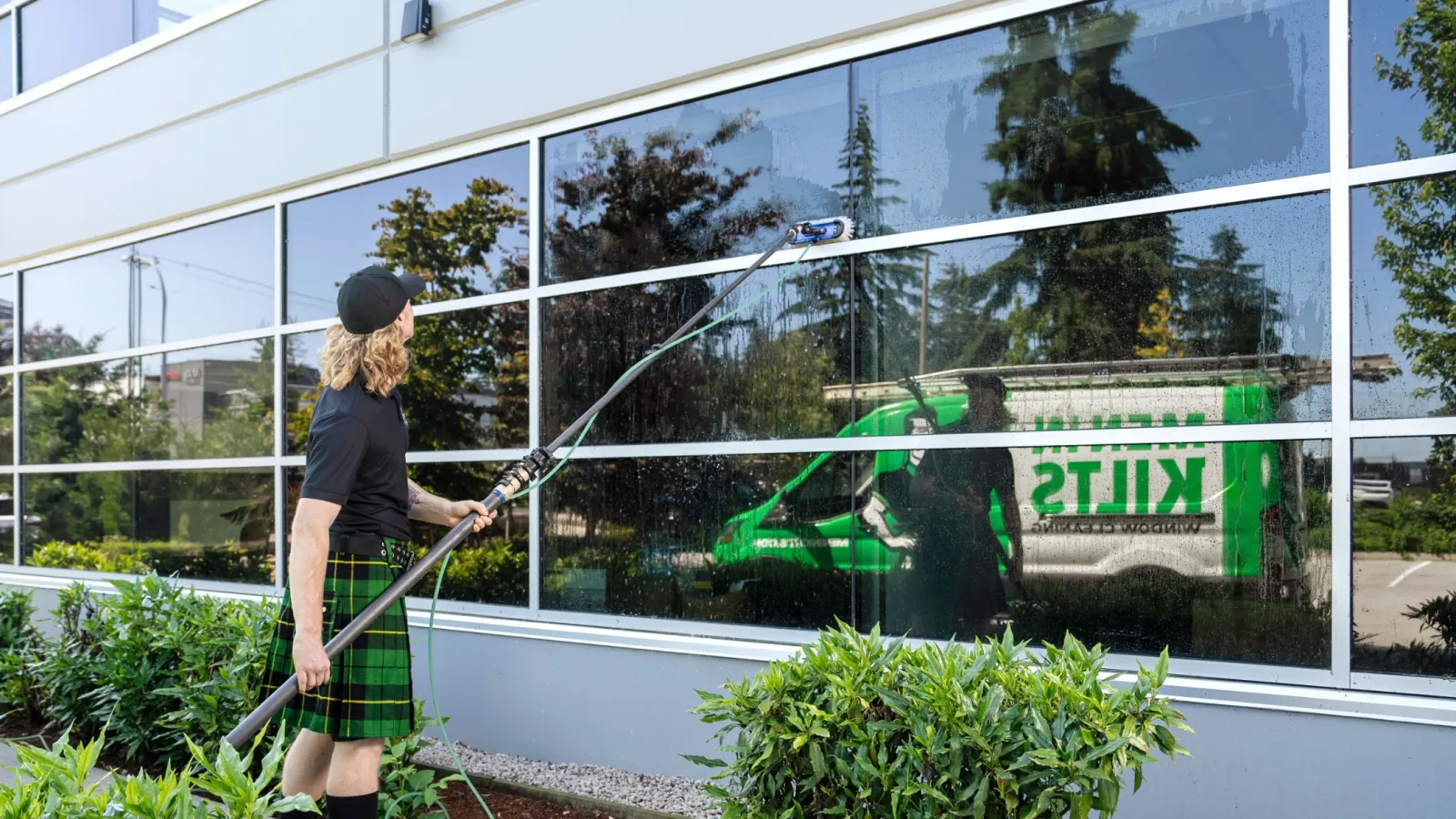 a man washing a window