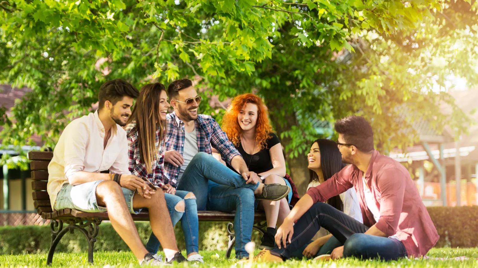 a group of people sitting on a bench