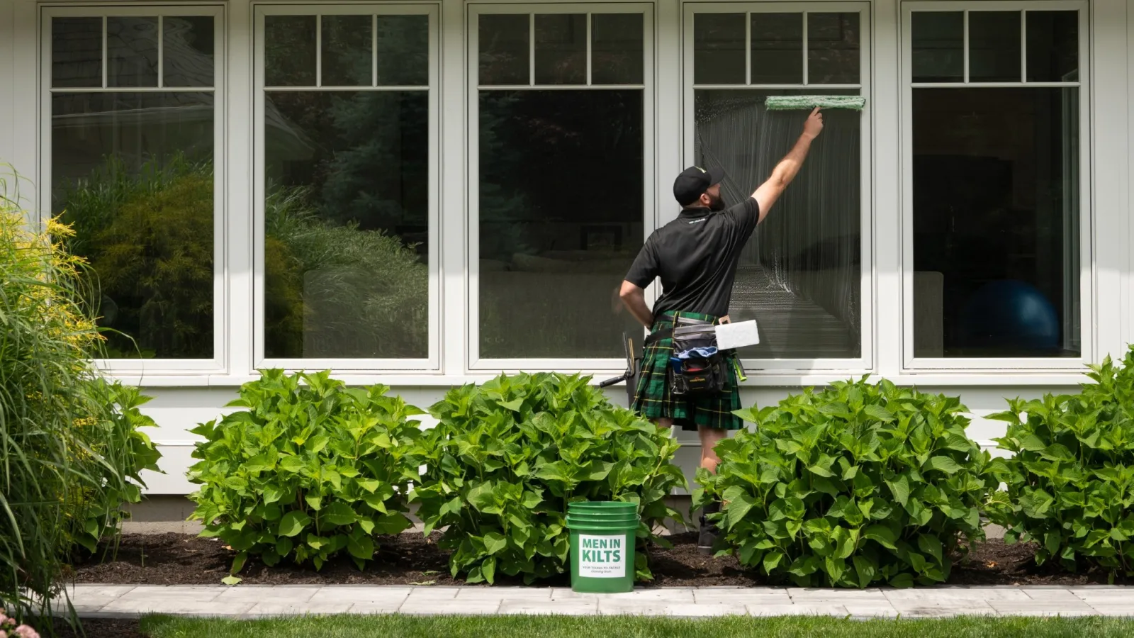 a man standing outside a house