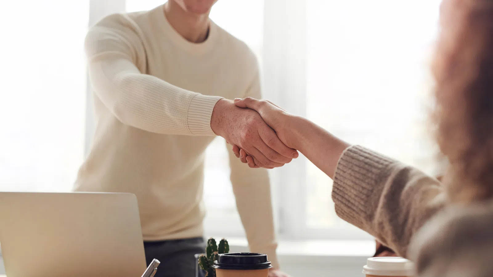 a man and a woman shaking hands