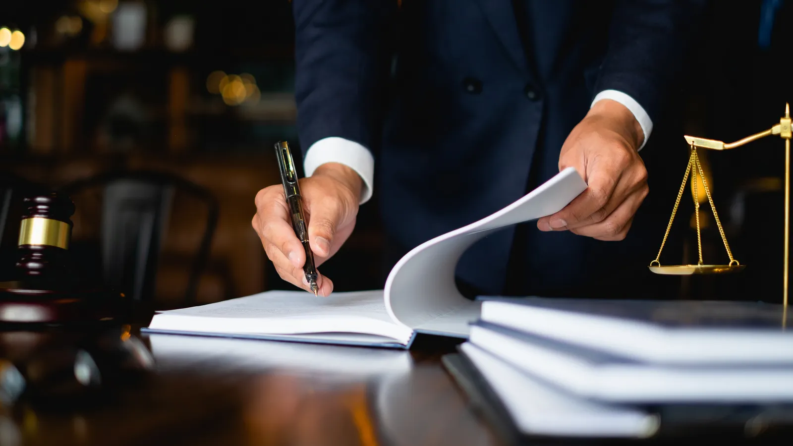 a person writing on a piece of paper