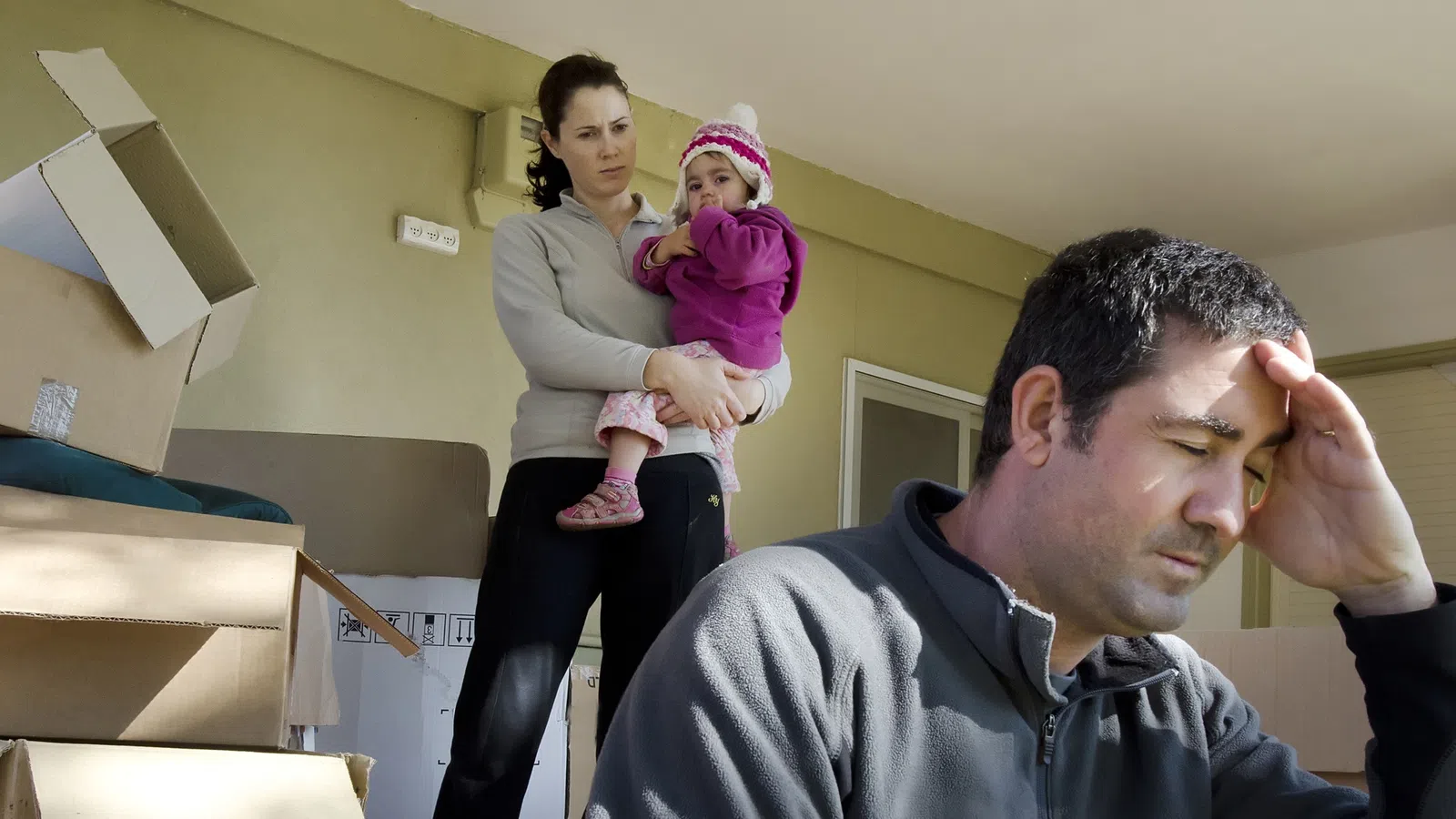 A stressed father contemplating child custody after moving out of state