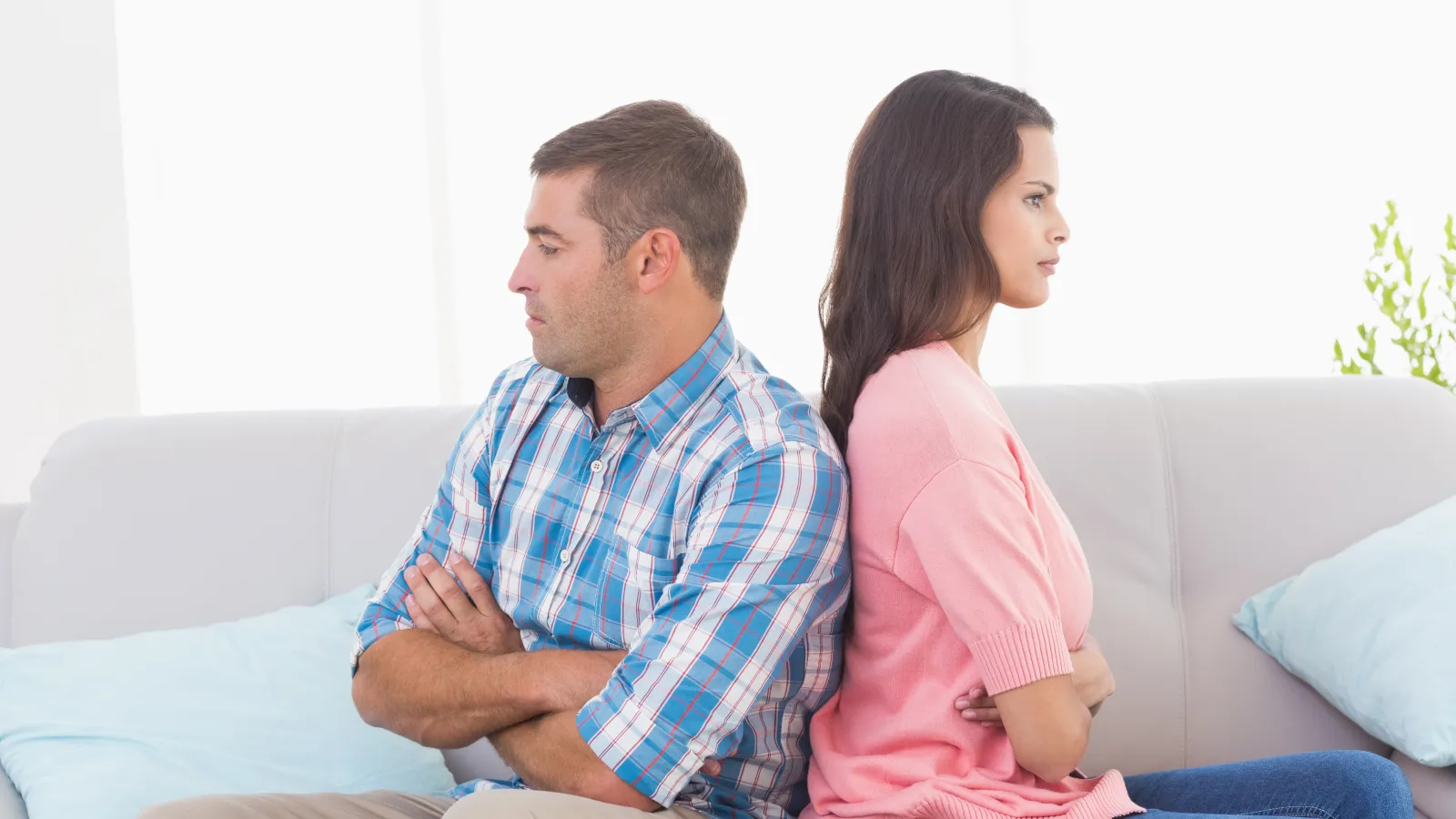 a man and a woman sitting on a couch