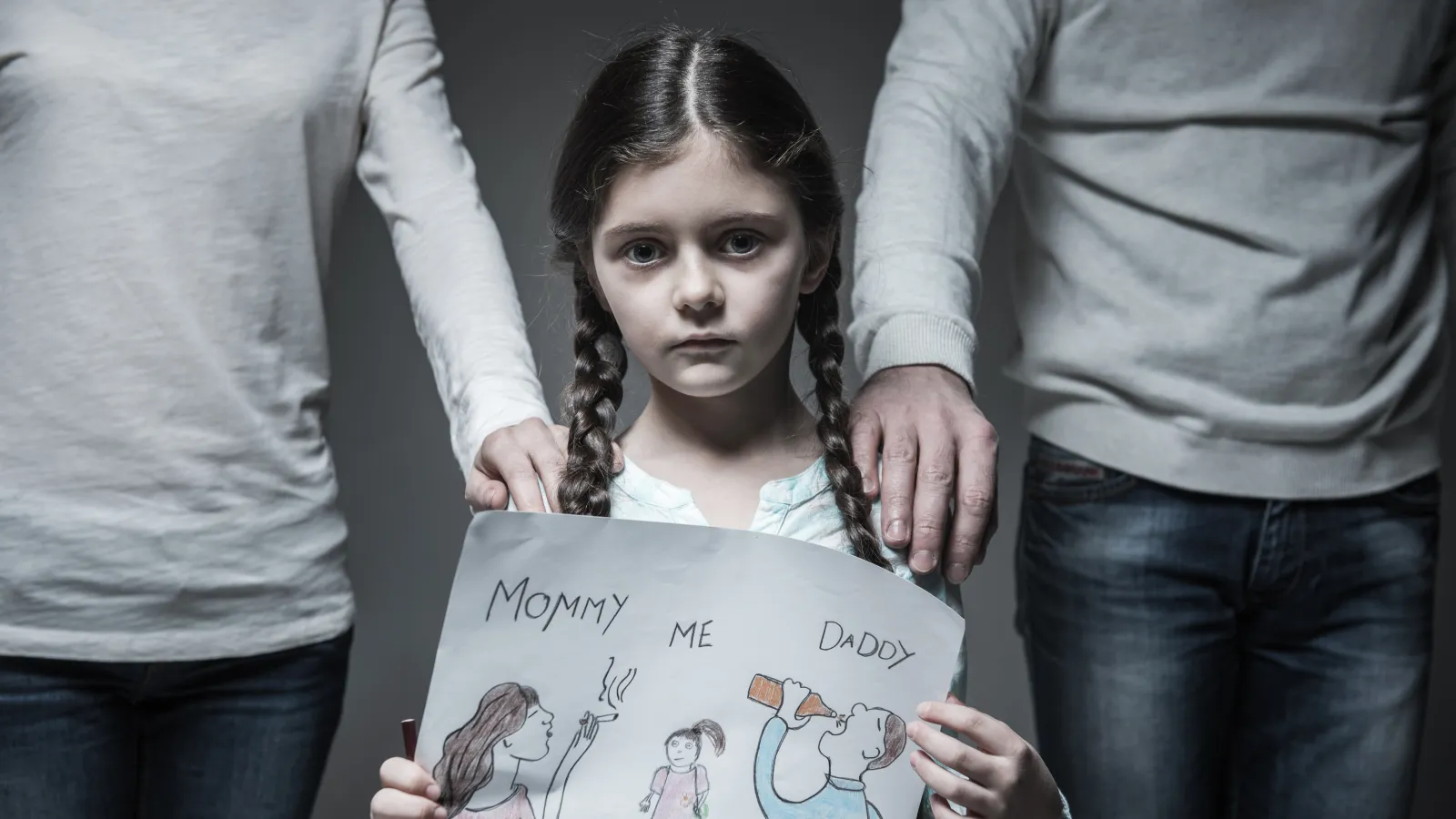 a girl holding a sign