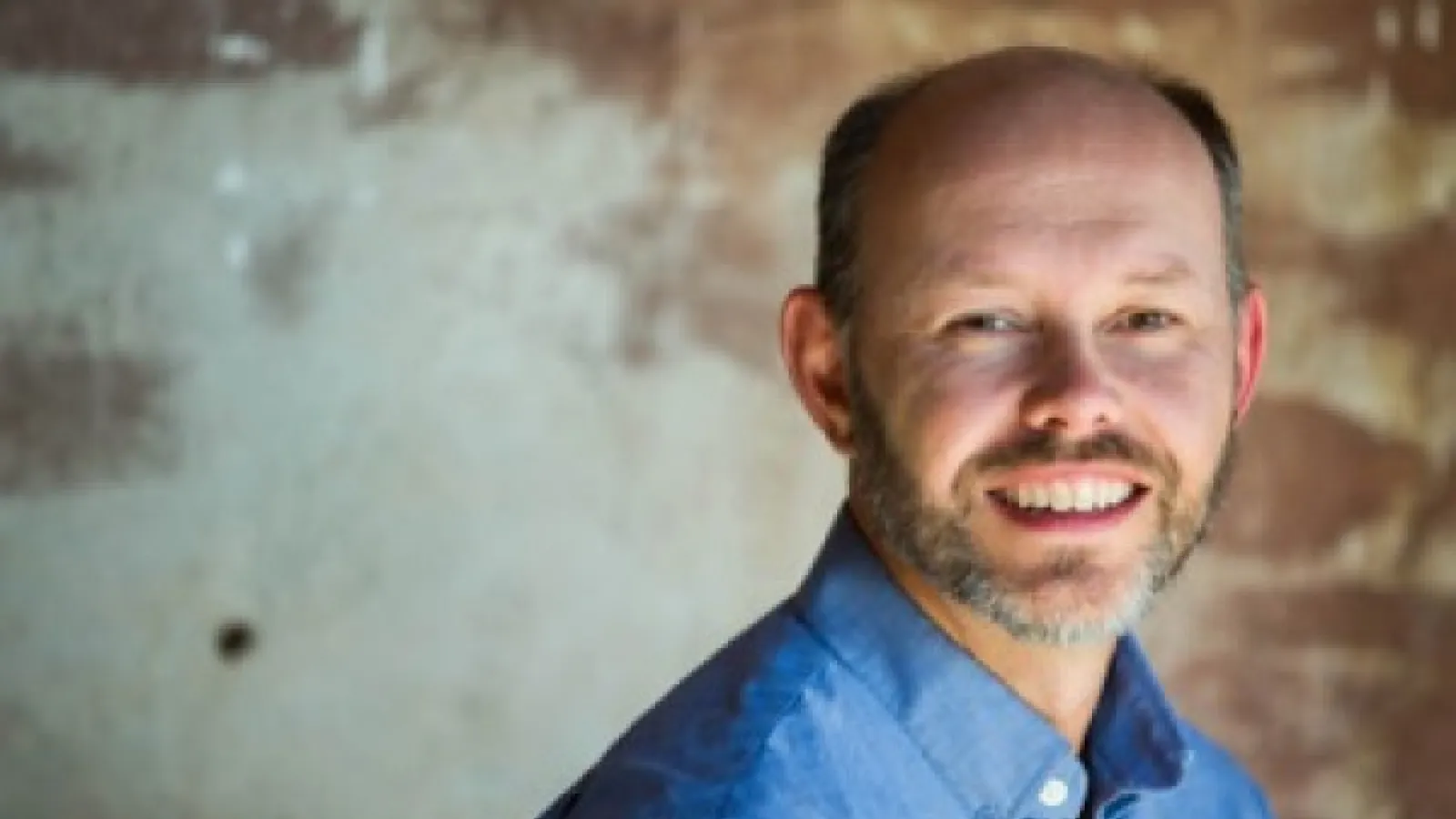 a man smiling for the camera