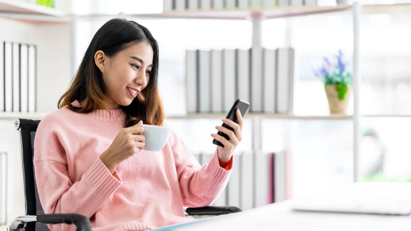 a woman holding a phone