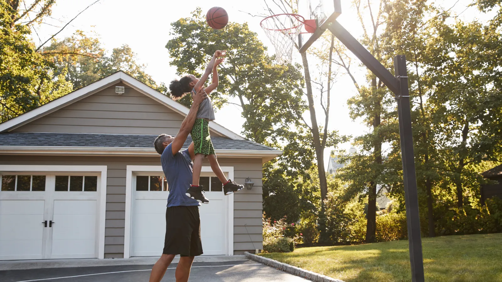 a man jumping to catch a basketball