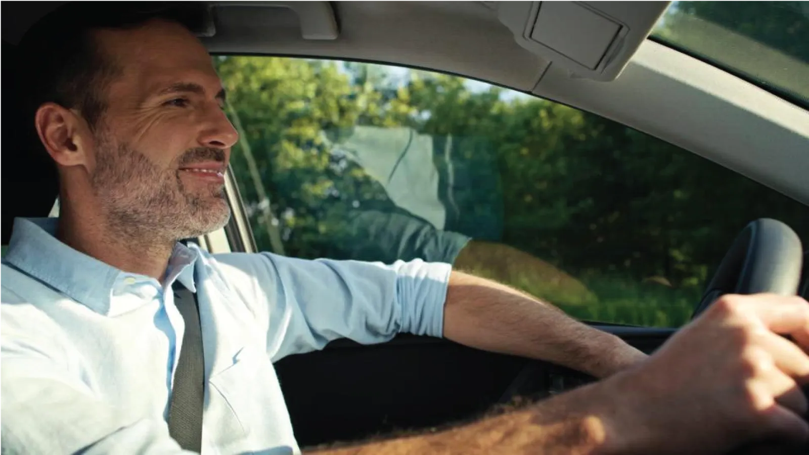 a man driving a car