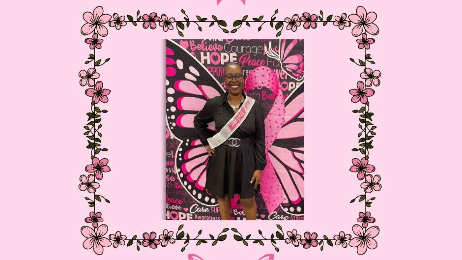 Woman wearing a pink breast cancer awareness sash standing in front of a pink butterfly and ribbon background with floral border.