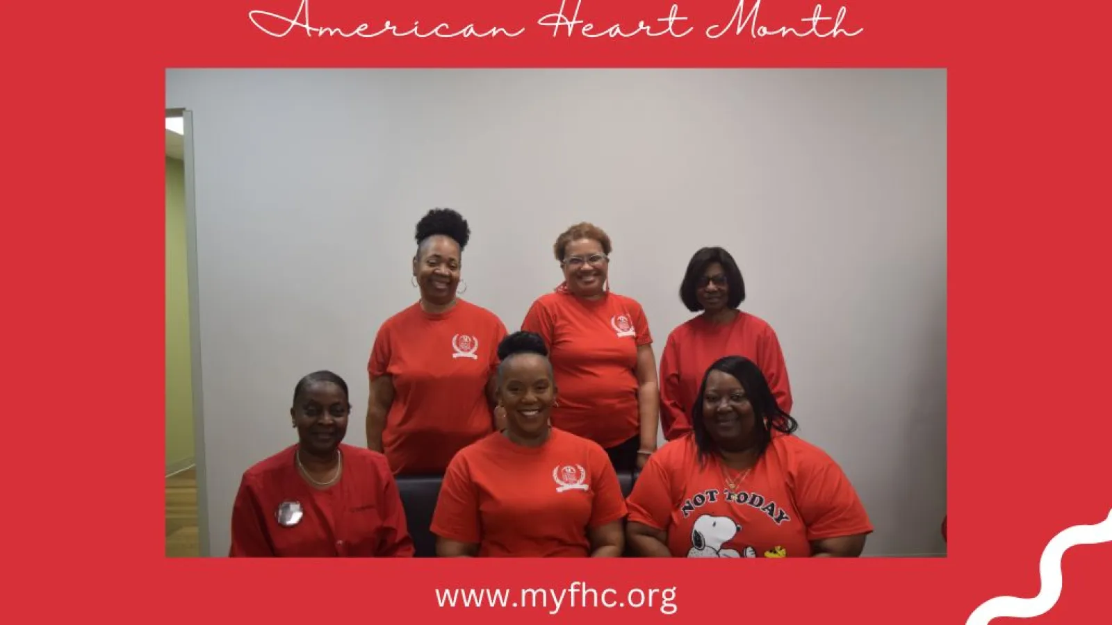 a group of people wearing red shirts