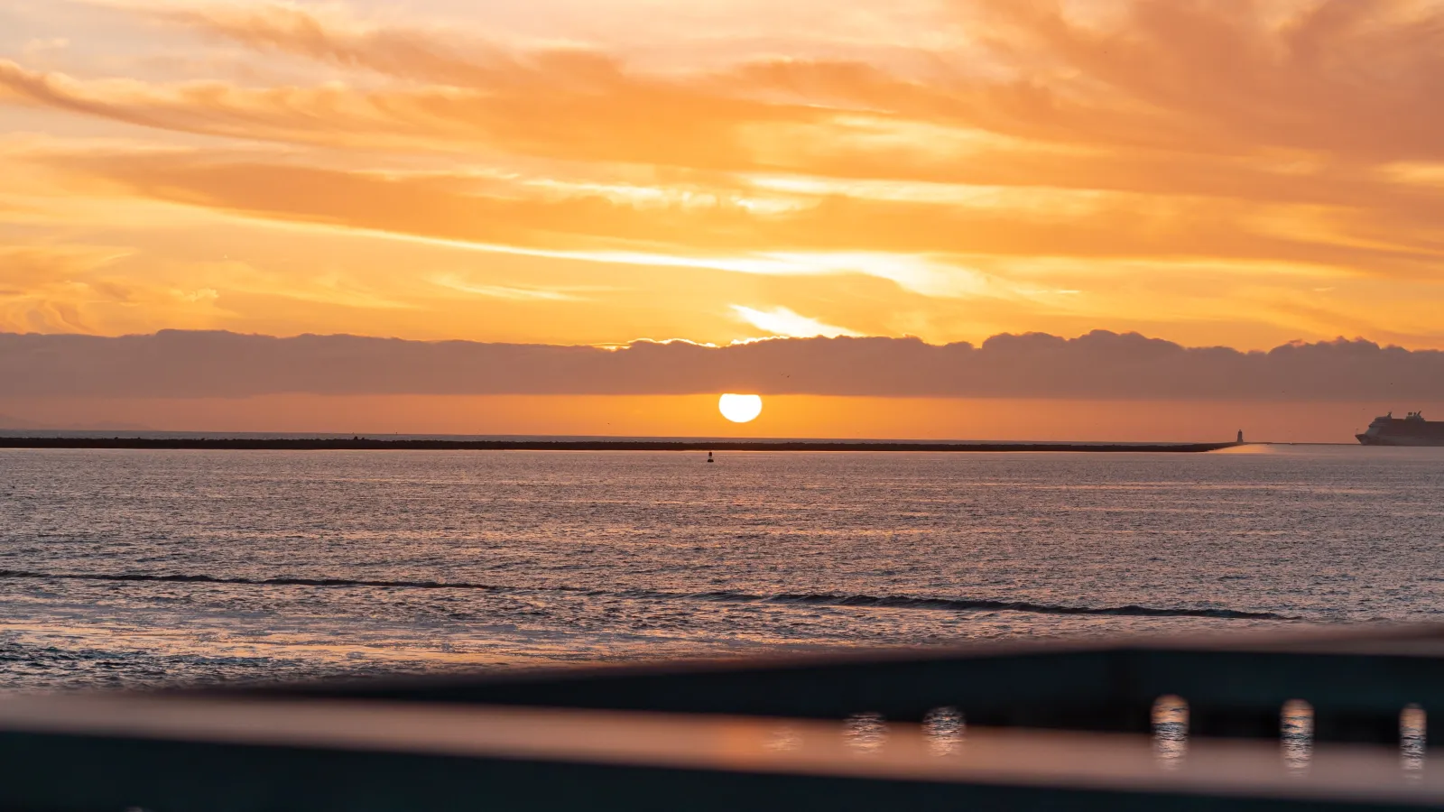 a sunset over a body of water