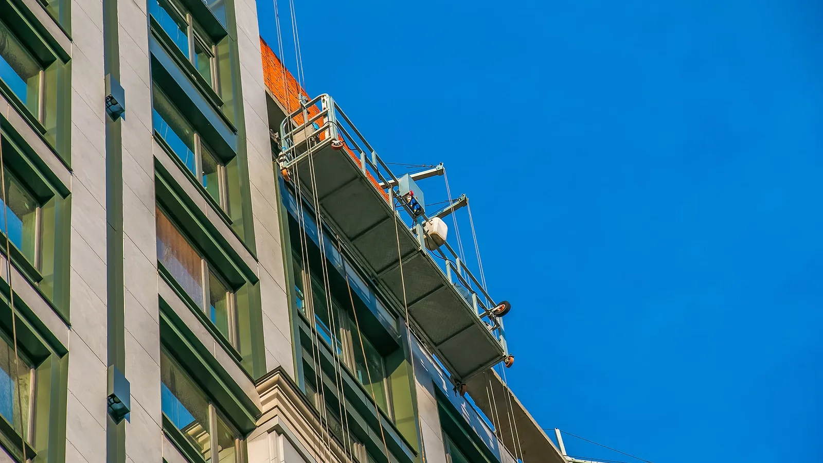 men painting a commercial building in Atlanta