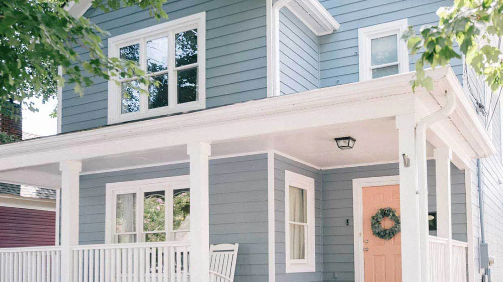 a house with a porch and a white fence in Marietta, GA