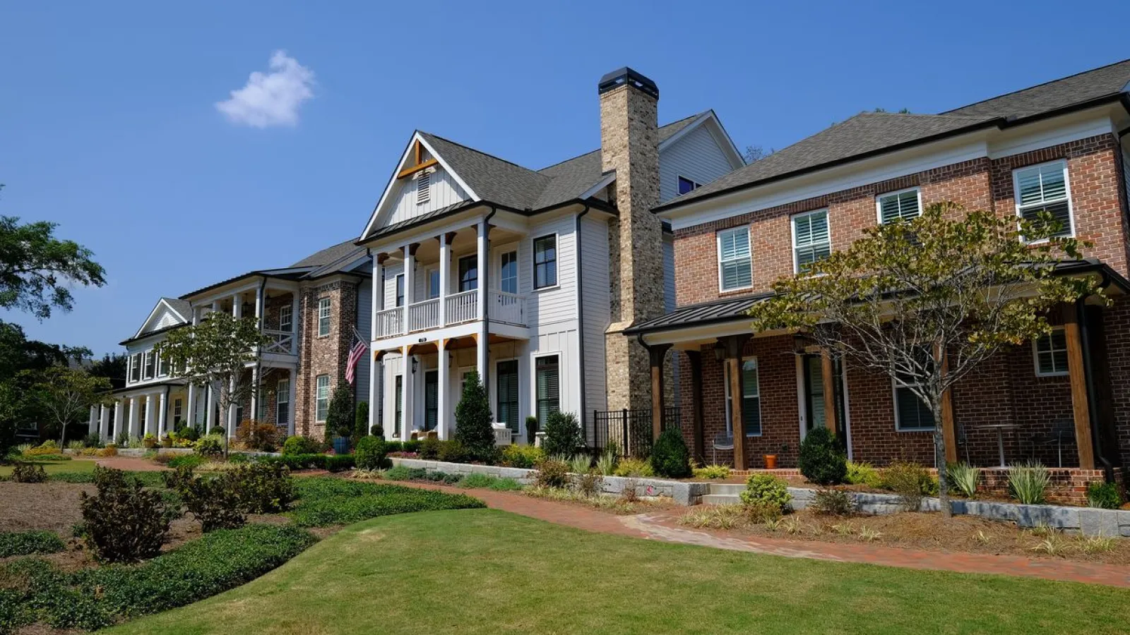 Multiple large houses with several windows and brick siding in Marietta, GA