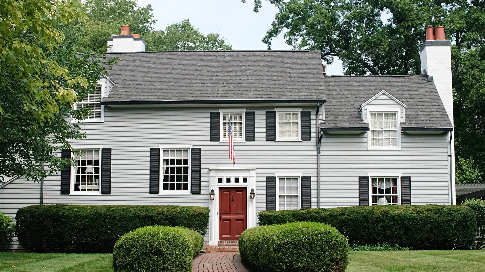House with white siding and black roof in Marietta, GA