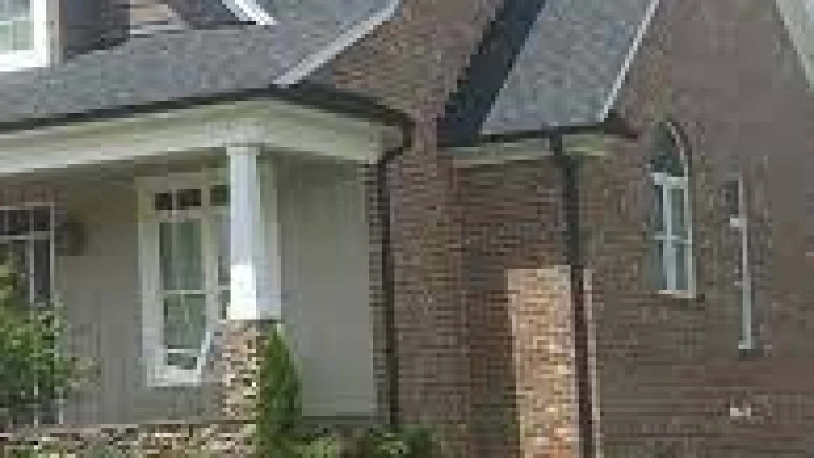 a brick house with a grass yard in Marietta, GA