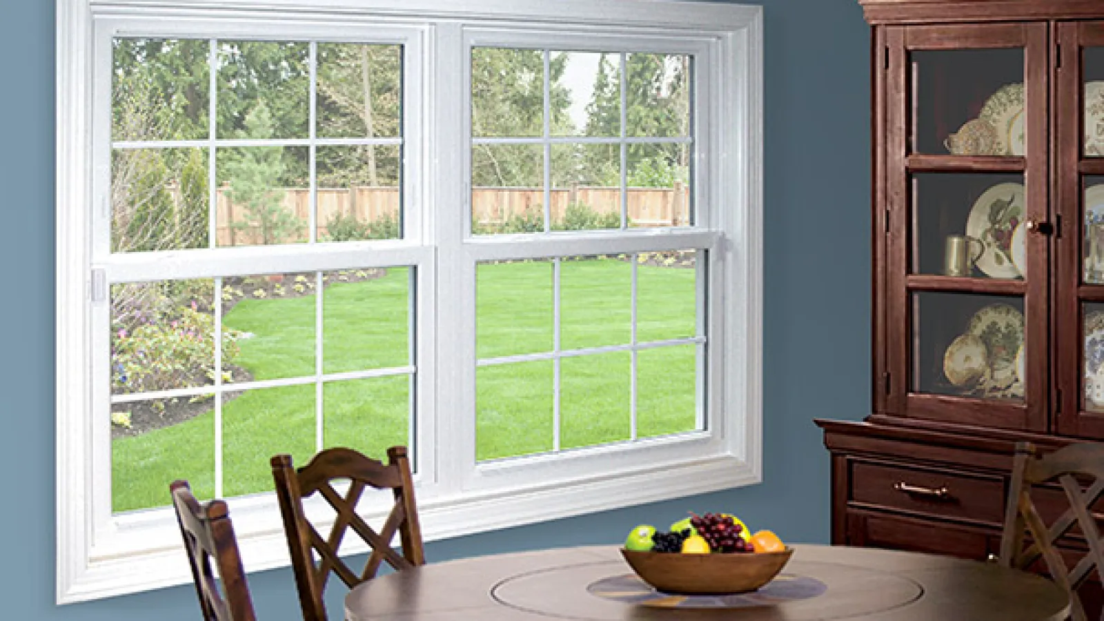 a table with a bowl of fruit on it in front of a window in Marietta, GA