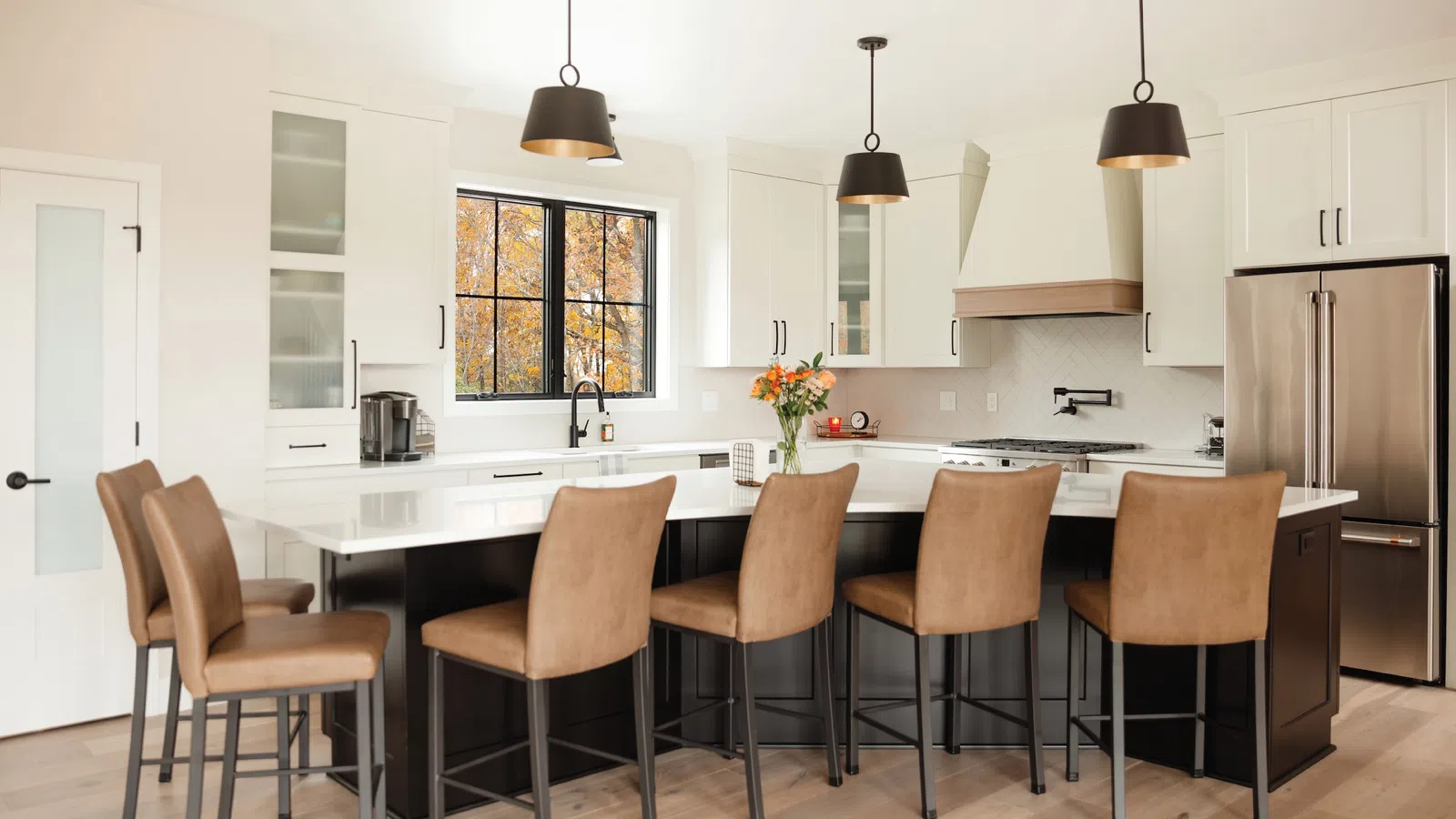 a kitchen with a table and chairs