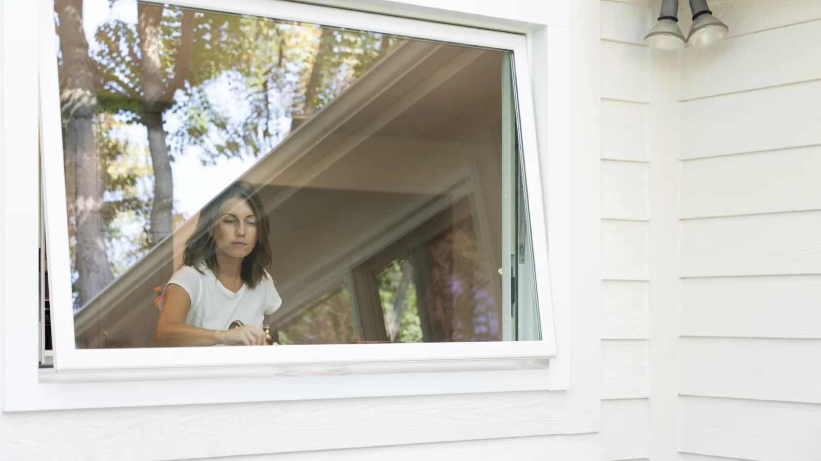 a person sitting in a window