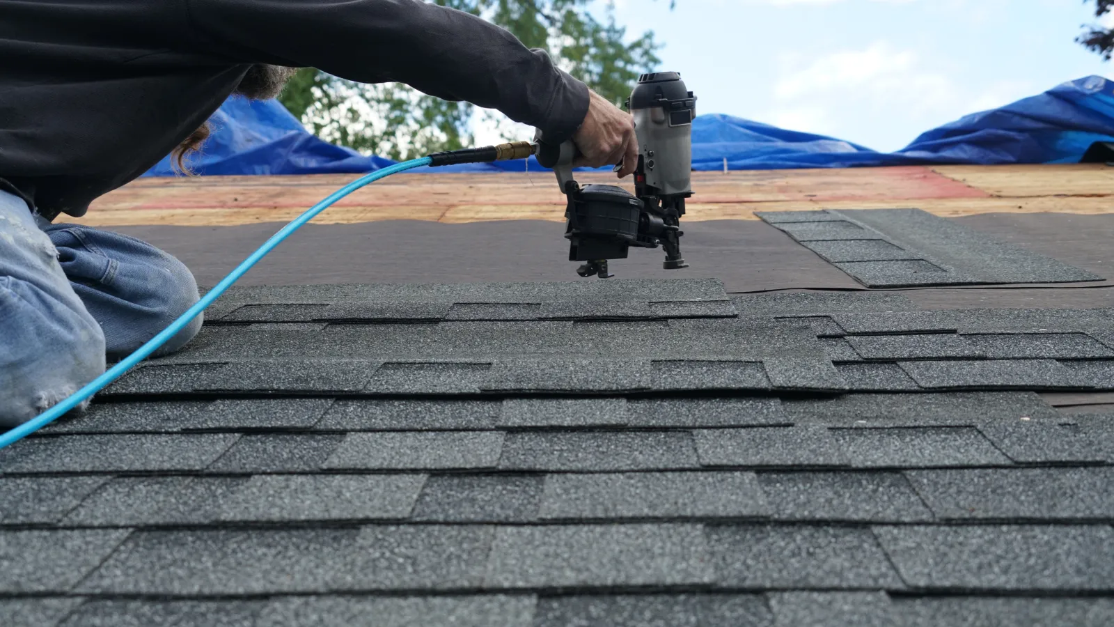 roofer installing roofing tiles ct
