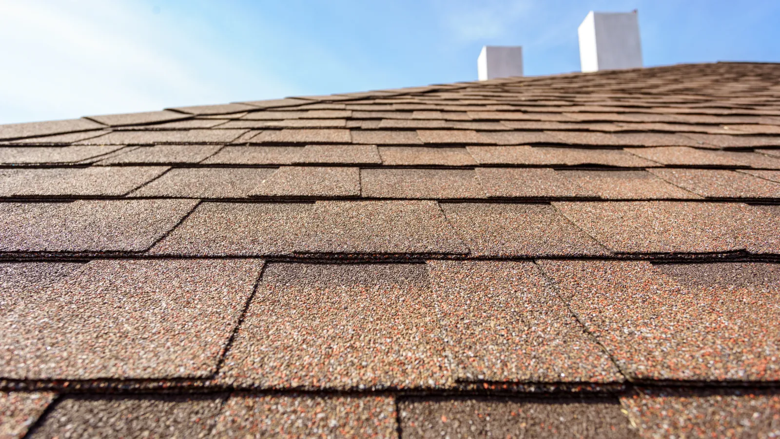 asphalt roofing shingles protecting a house