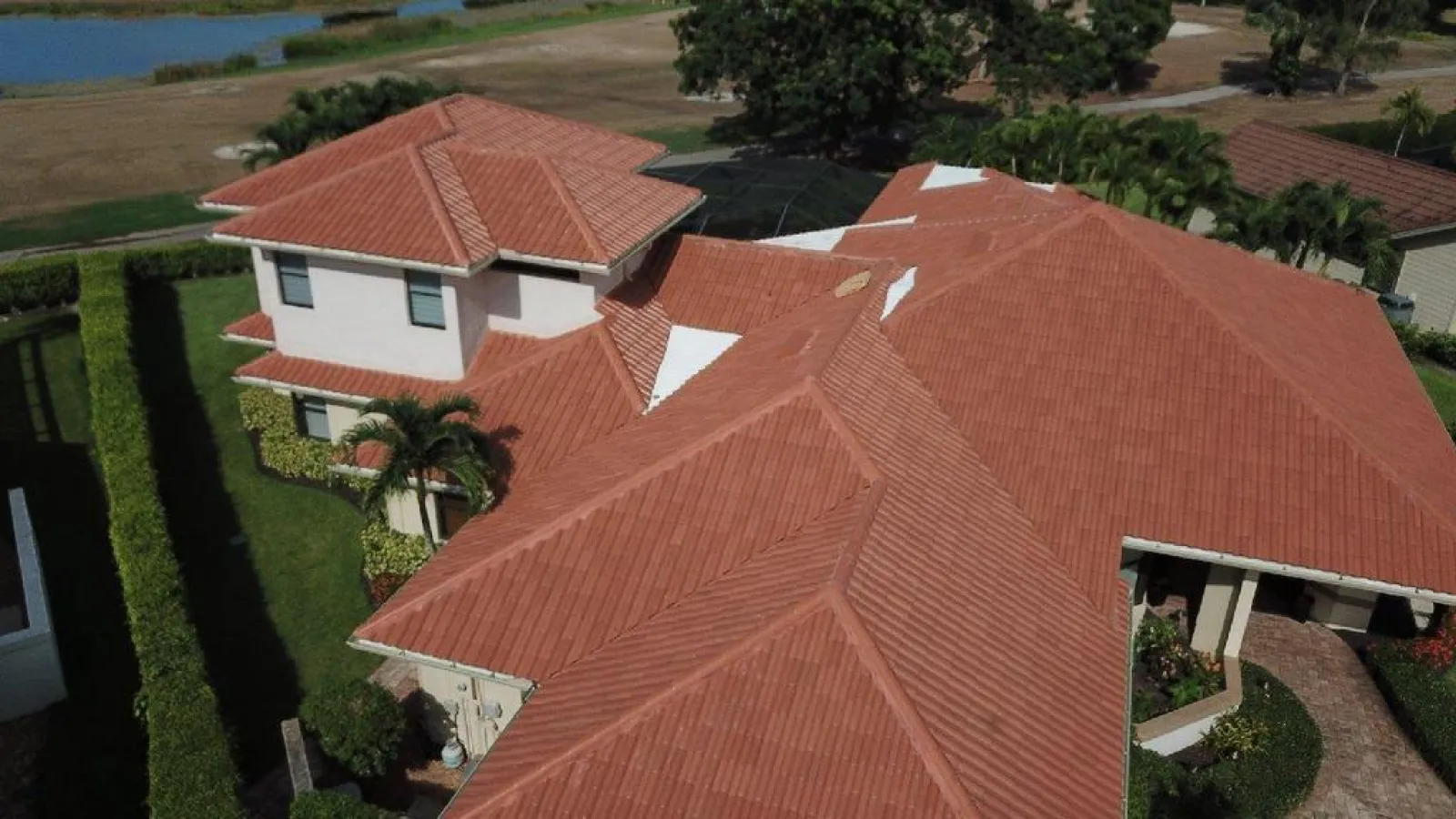 a high angle view of a florida home with new tile roofing