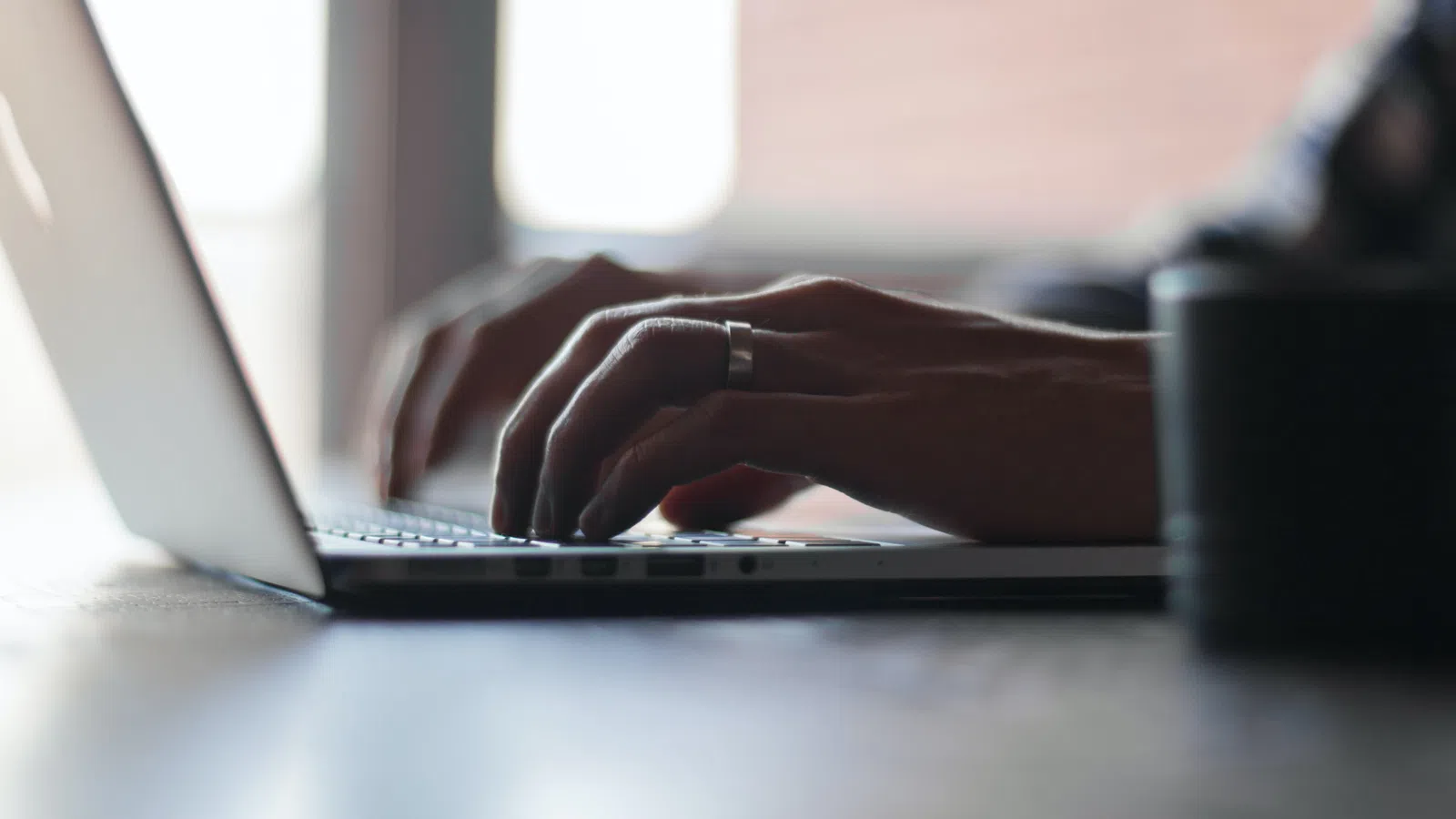 a person typing on a laptop