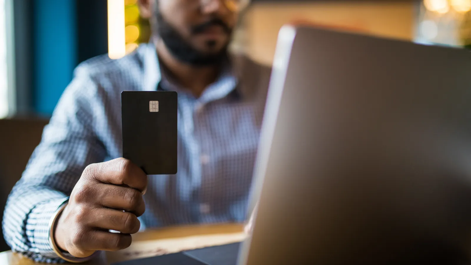 a person holding a credit card