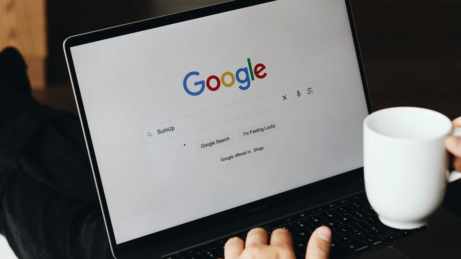 a person holding a laptop