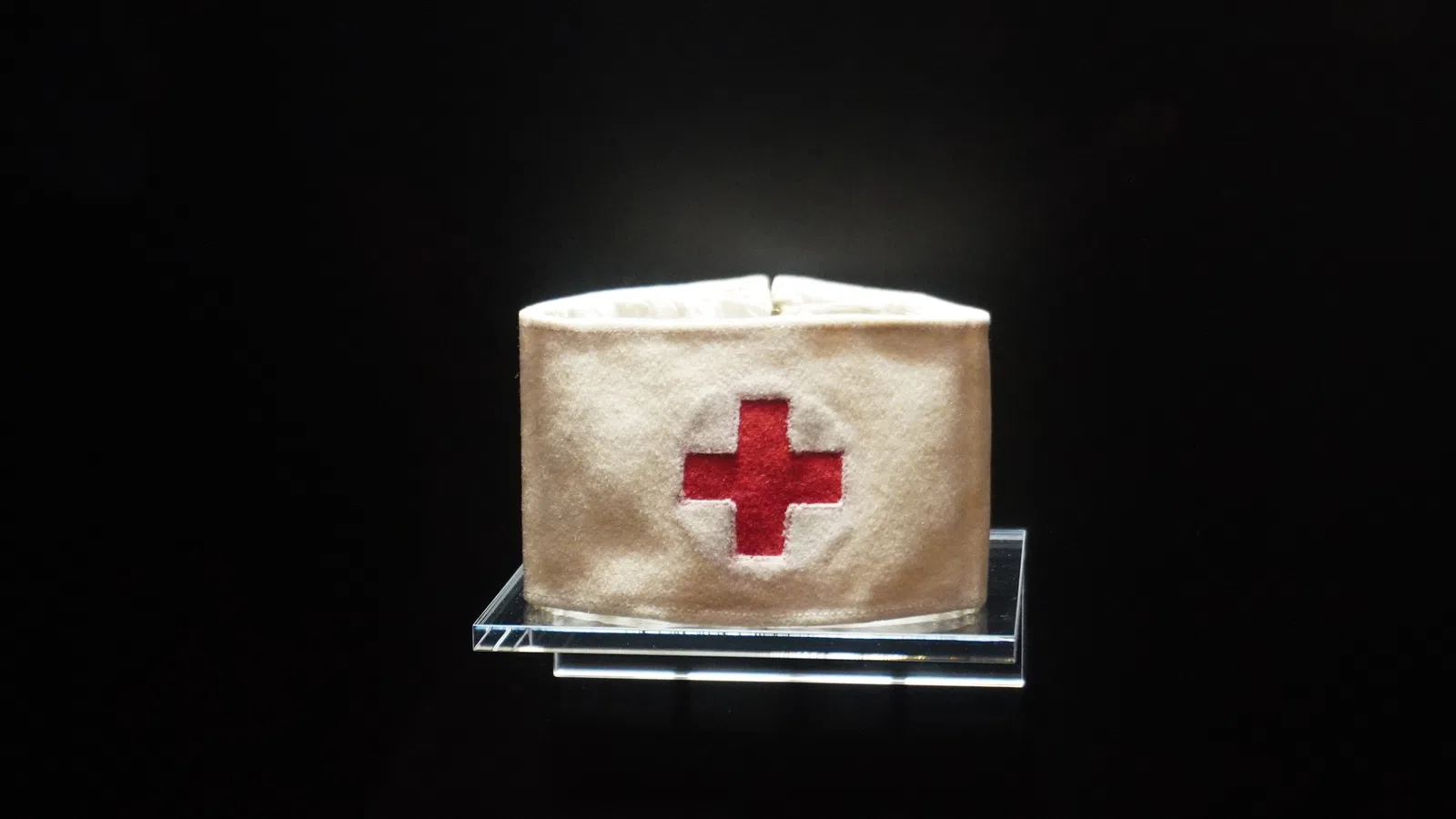 a white square with a red circle on it