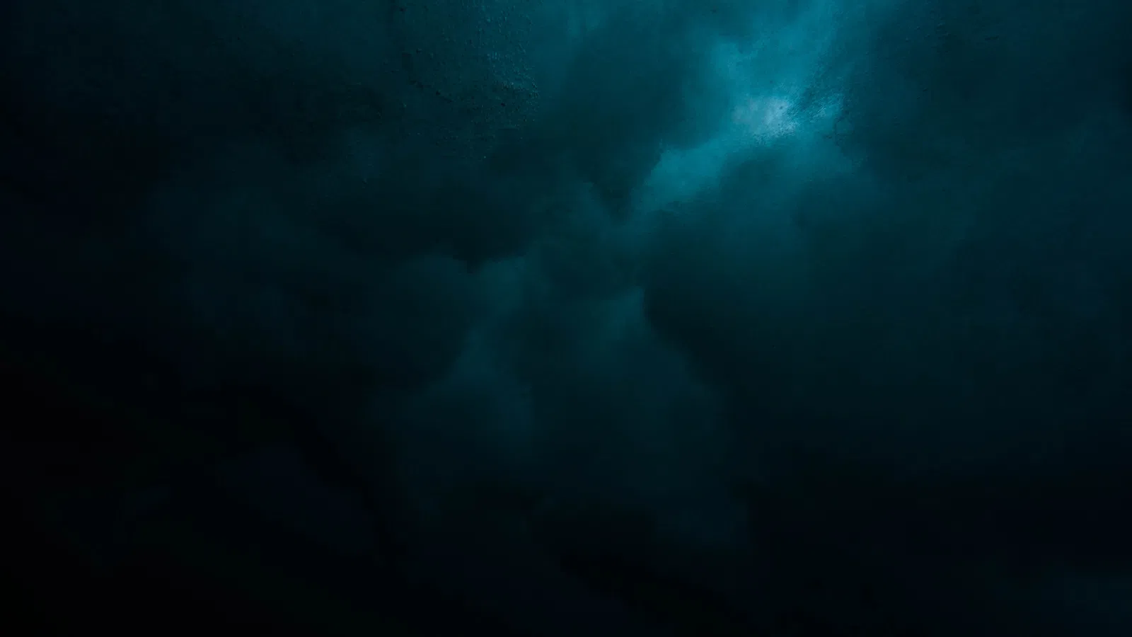 a dark sky with clouds