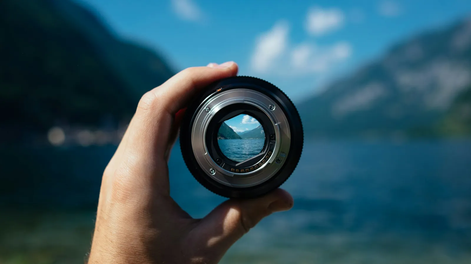 a hand holding a camera