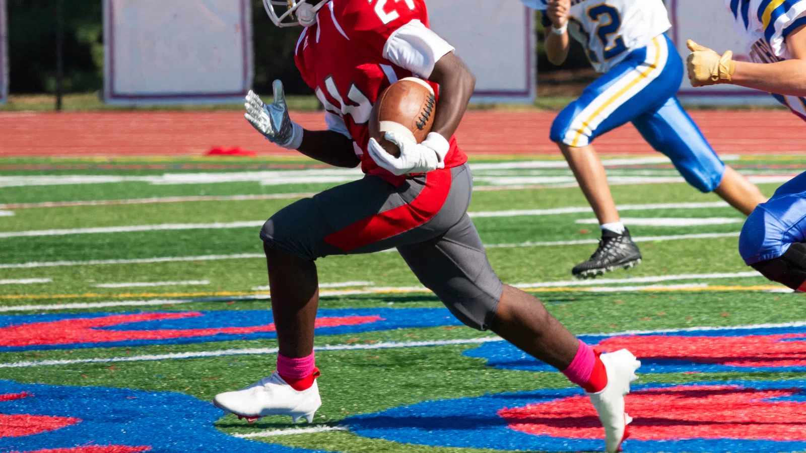 a football player in a red uniform
