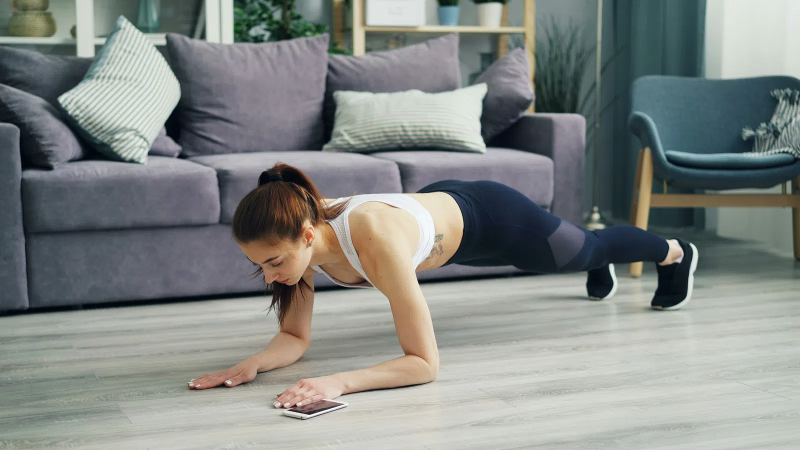 a woman sitting on a mat