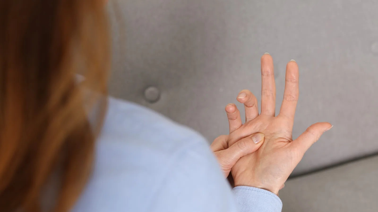 a woman holding her hand up