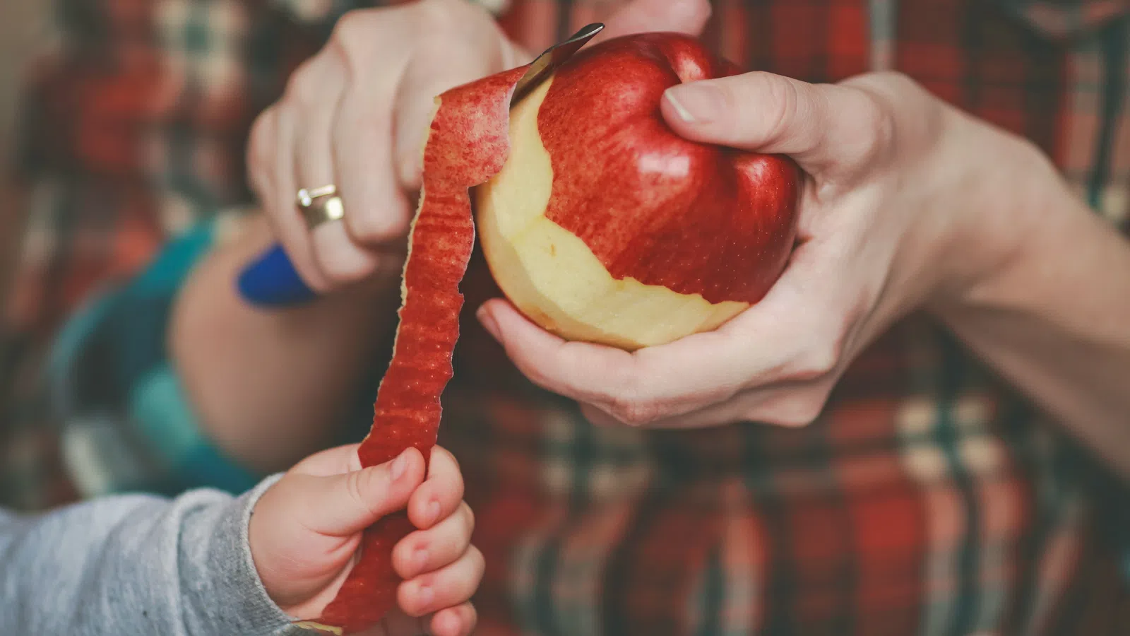 a person holding an apple