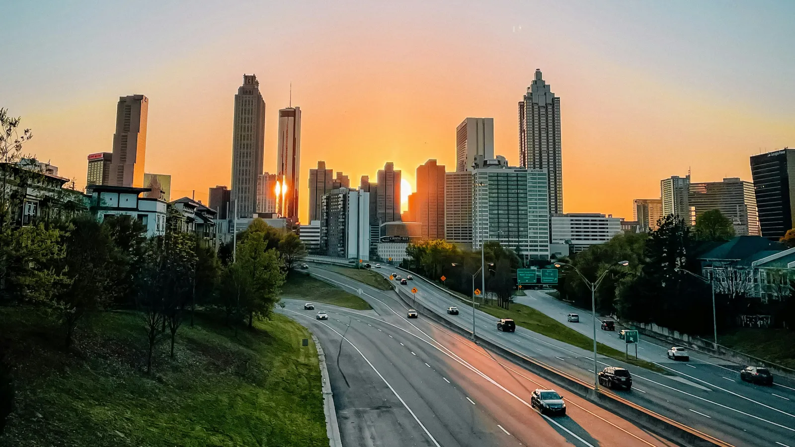 a city skyline with a freeway and cars