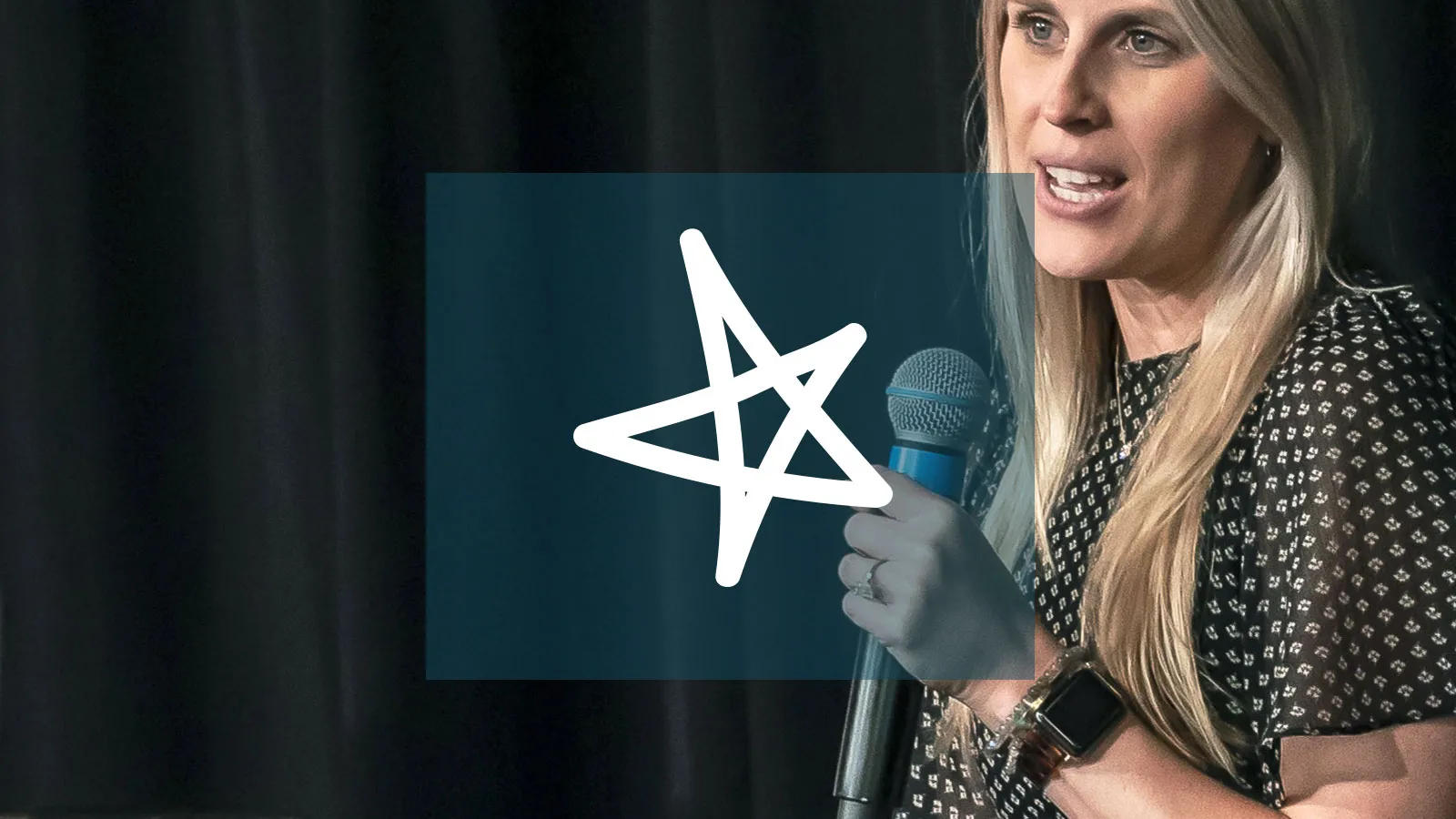 a woman speaking into a microphone