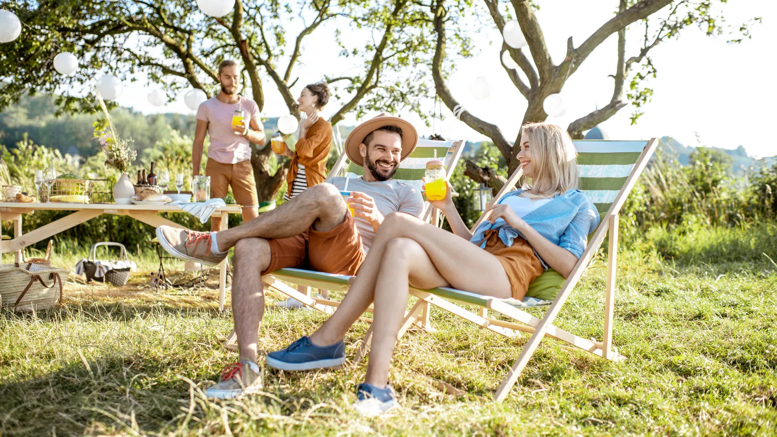 a group of people sitting in chairs outside