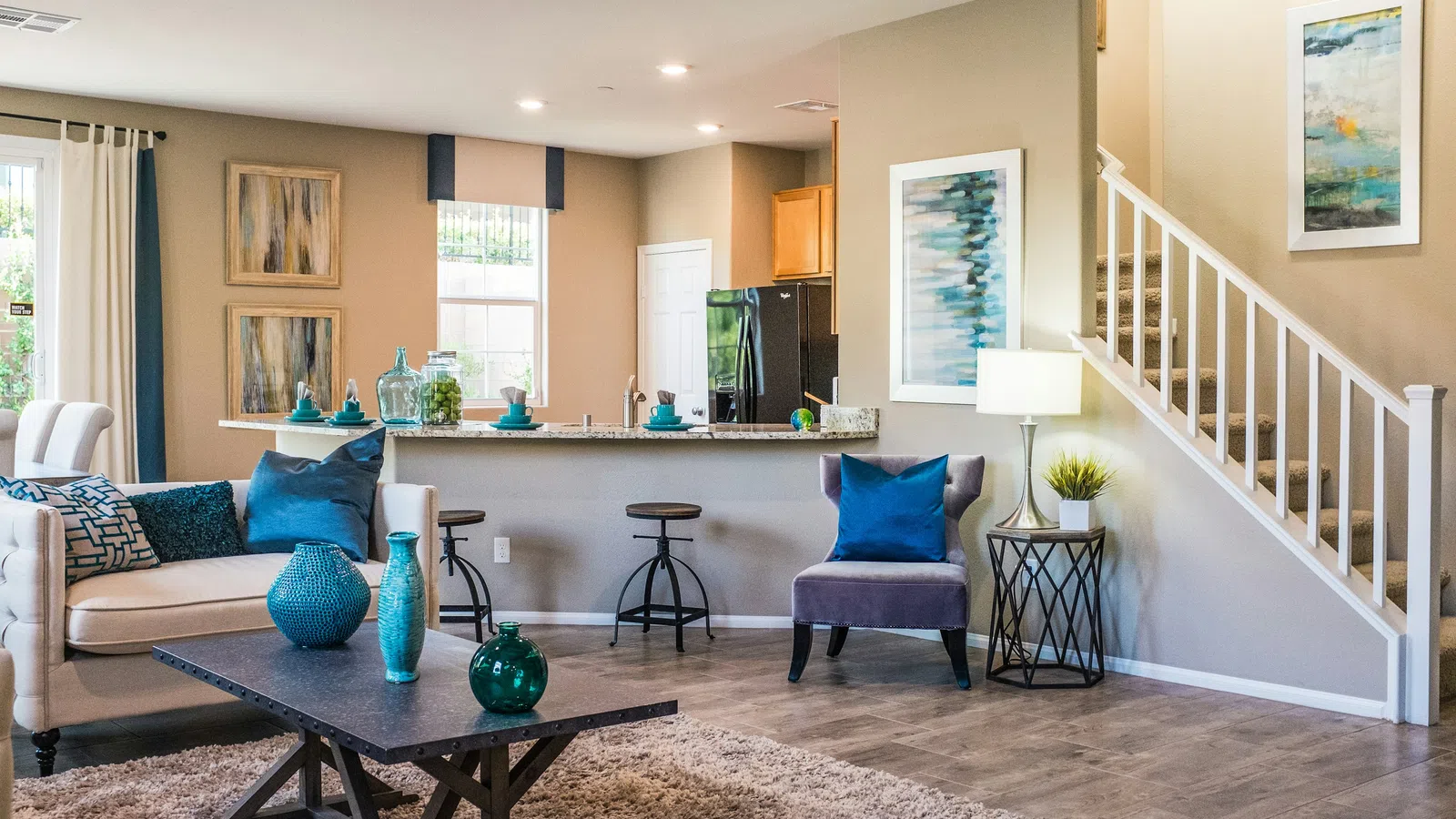 Bright and stylish living room with modern decor and colorful accents in natural light.