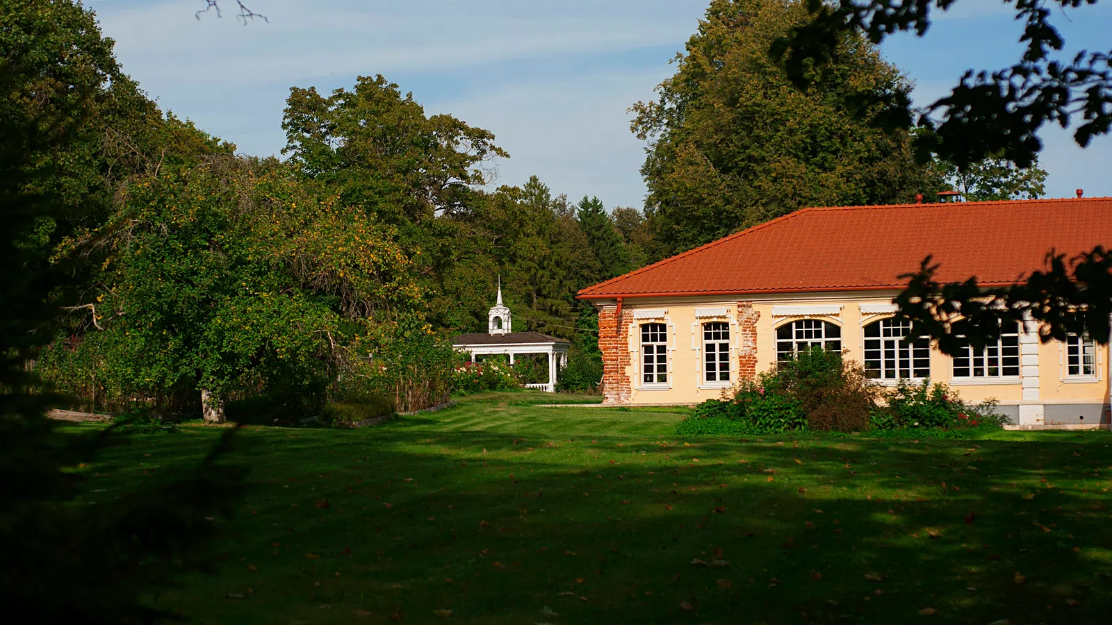 a large green lawn in front of a building