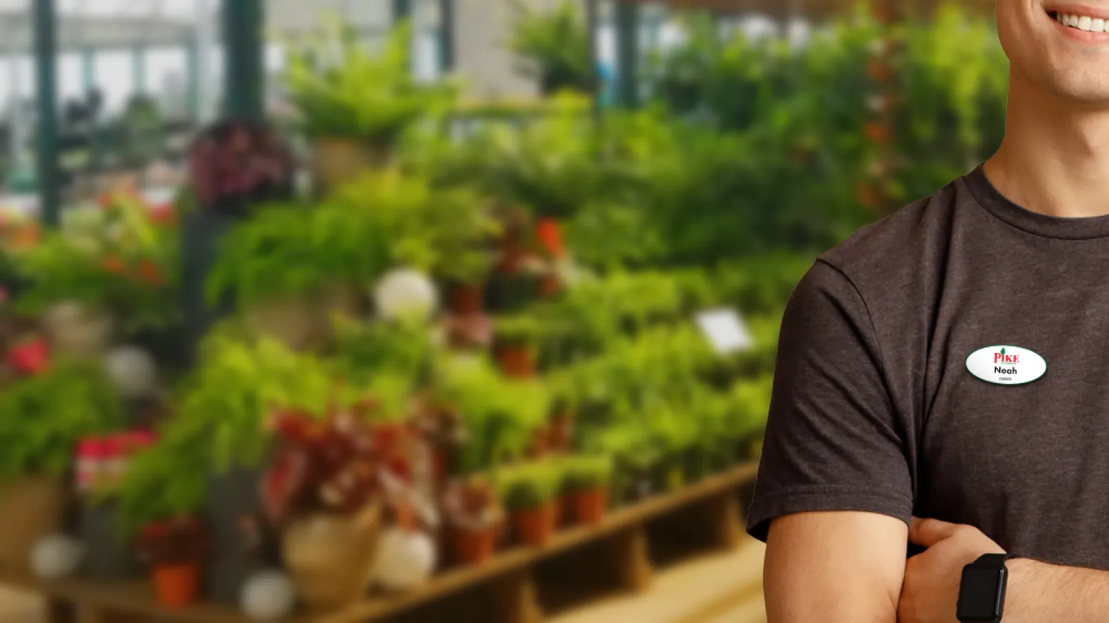 a man standing in a greenhouse