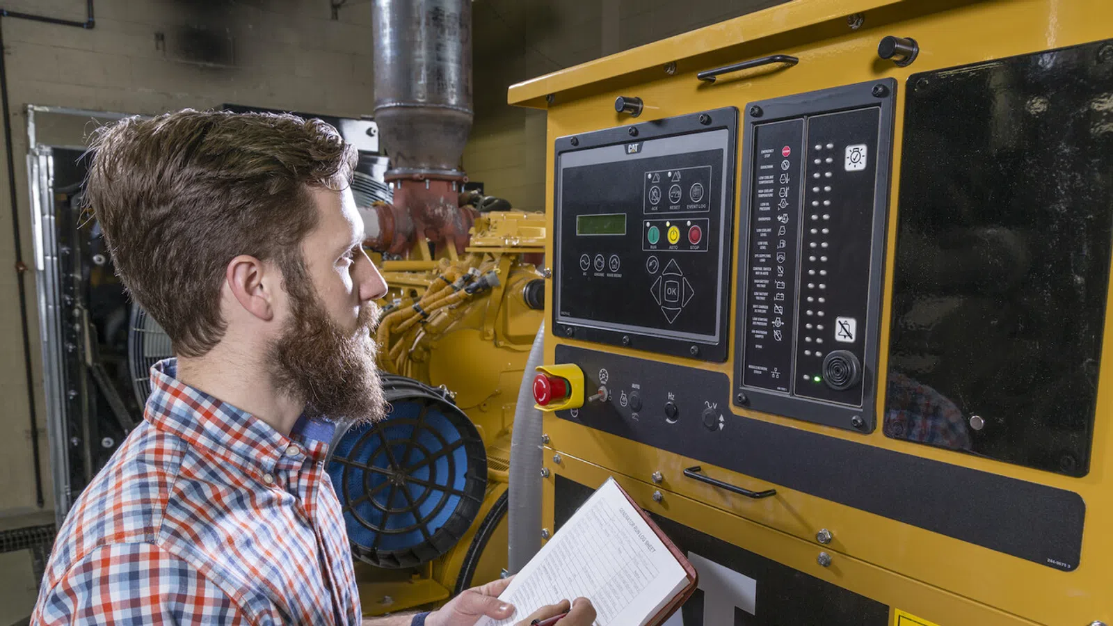 technician runs test on backup generator